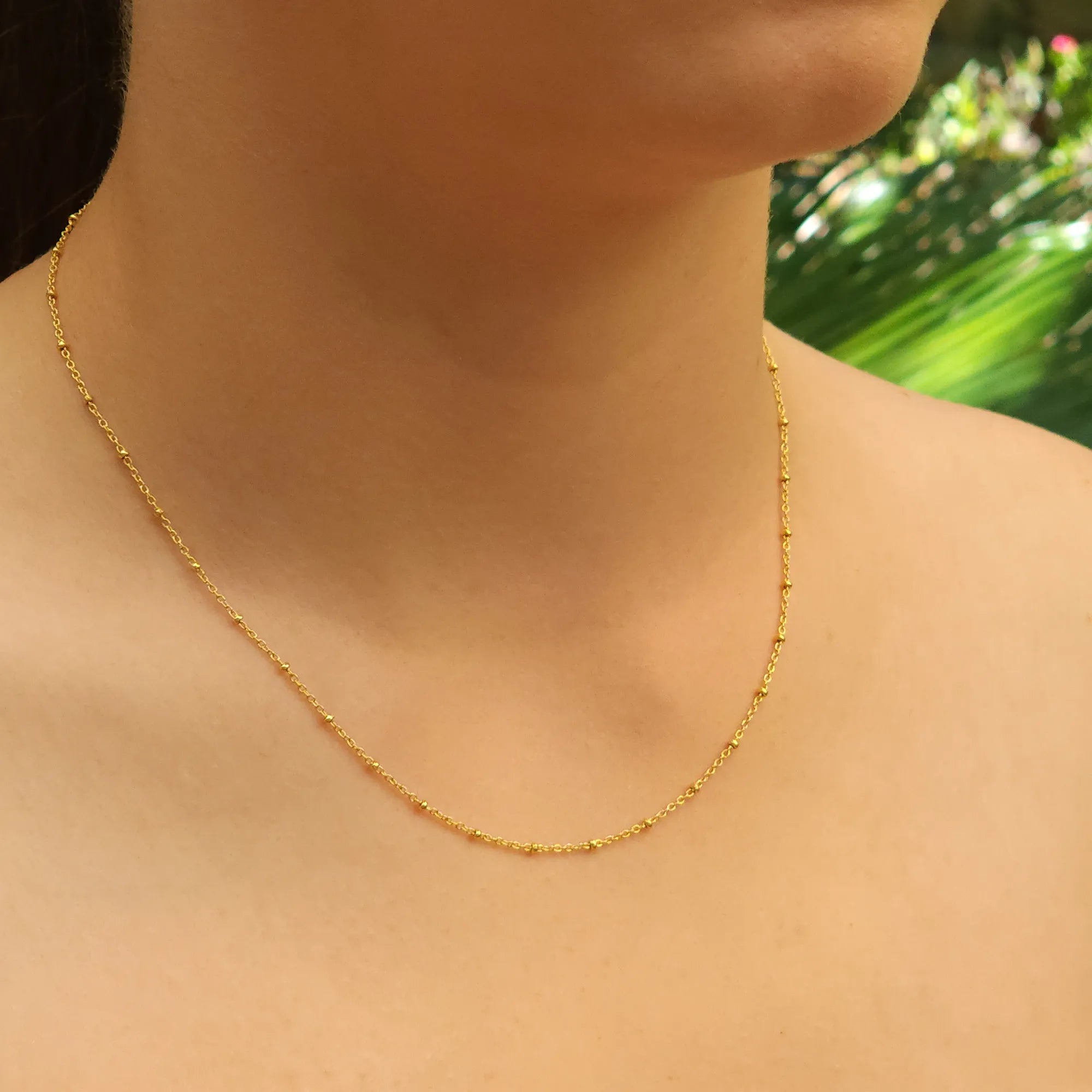 Side view of Yellow gold plated silver chain with small beads