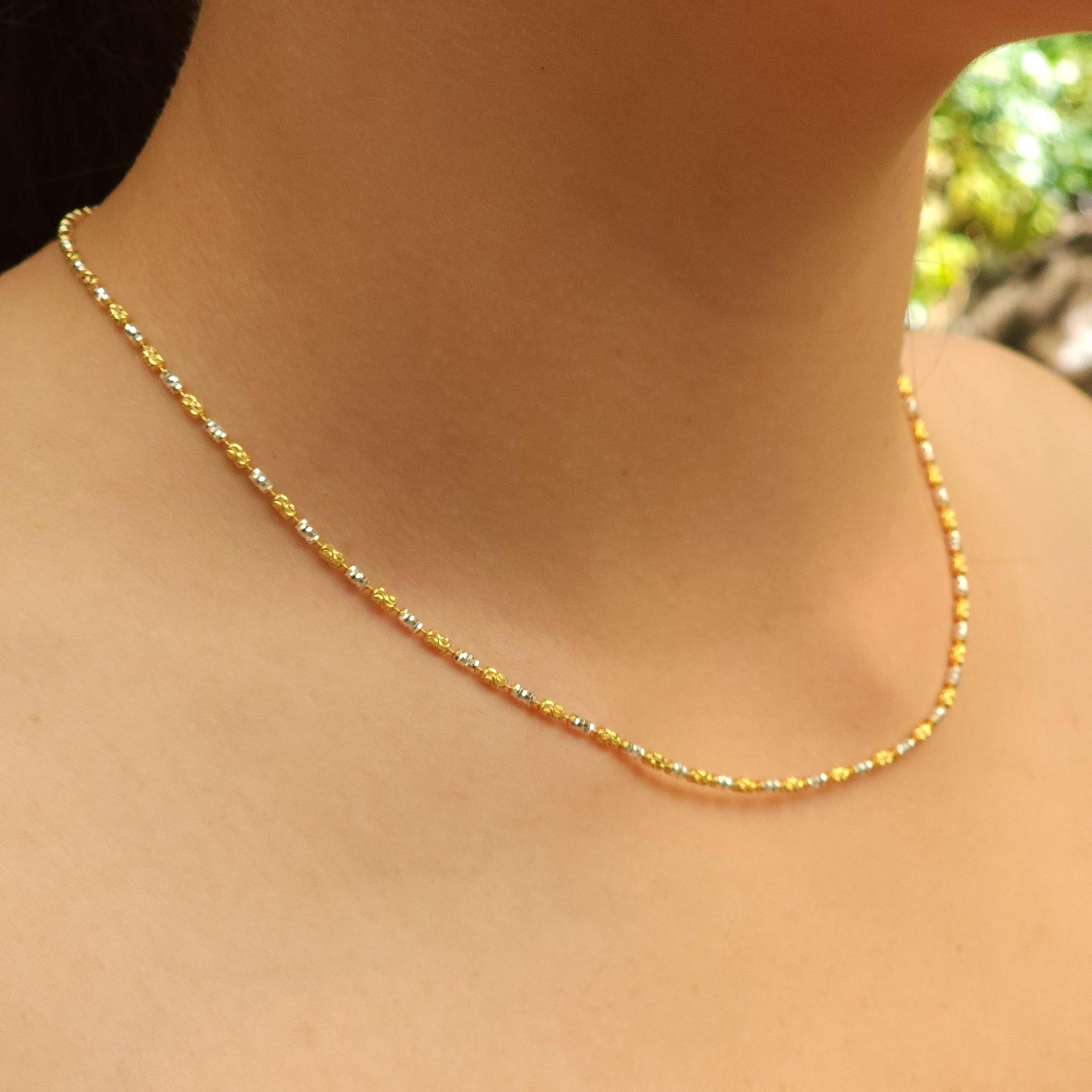 Detail view of Yellow Gold & Rodium Beaded Silver Chain