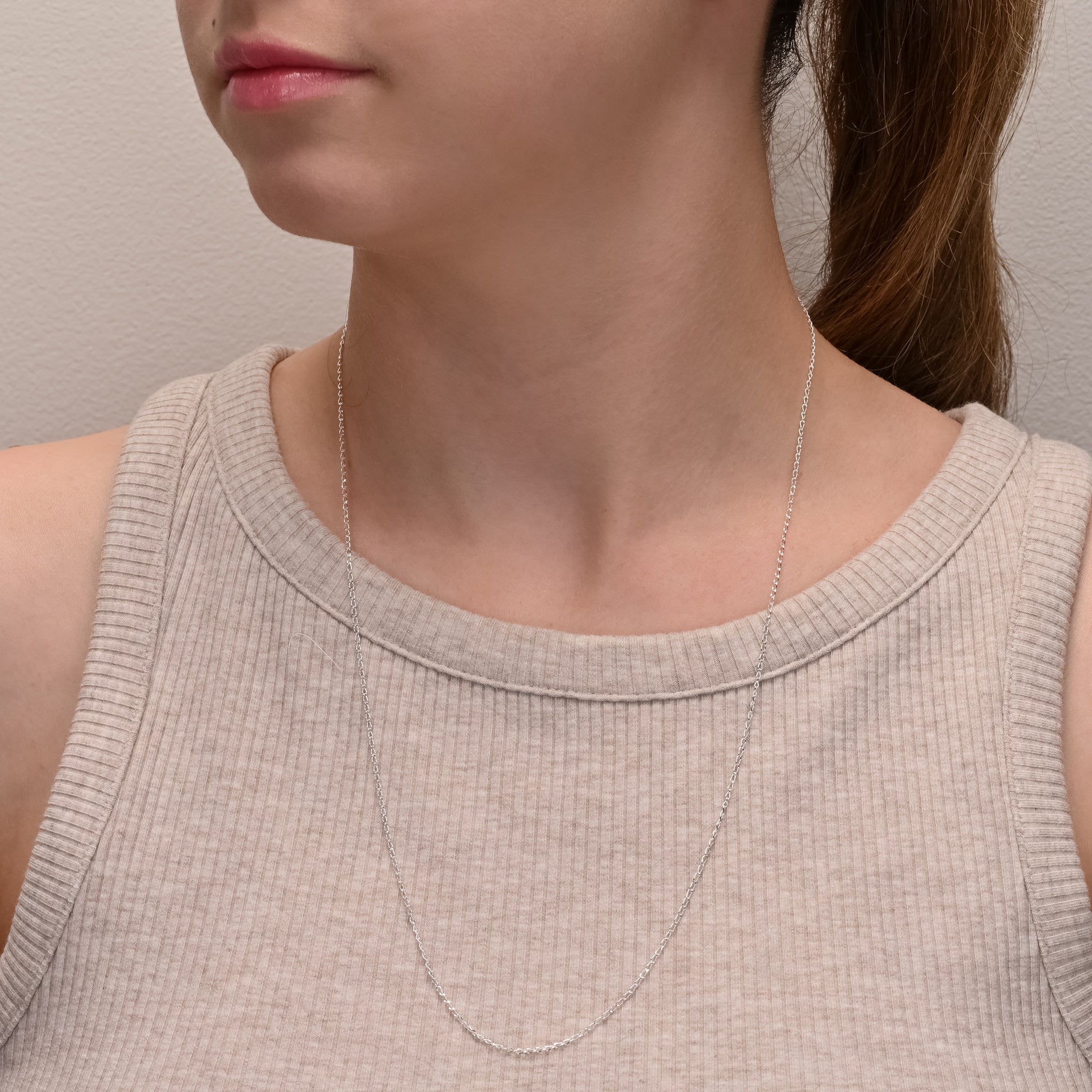 Side view of Long curb diamond cut silver chain 1.3mm
