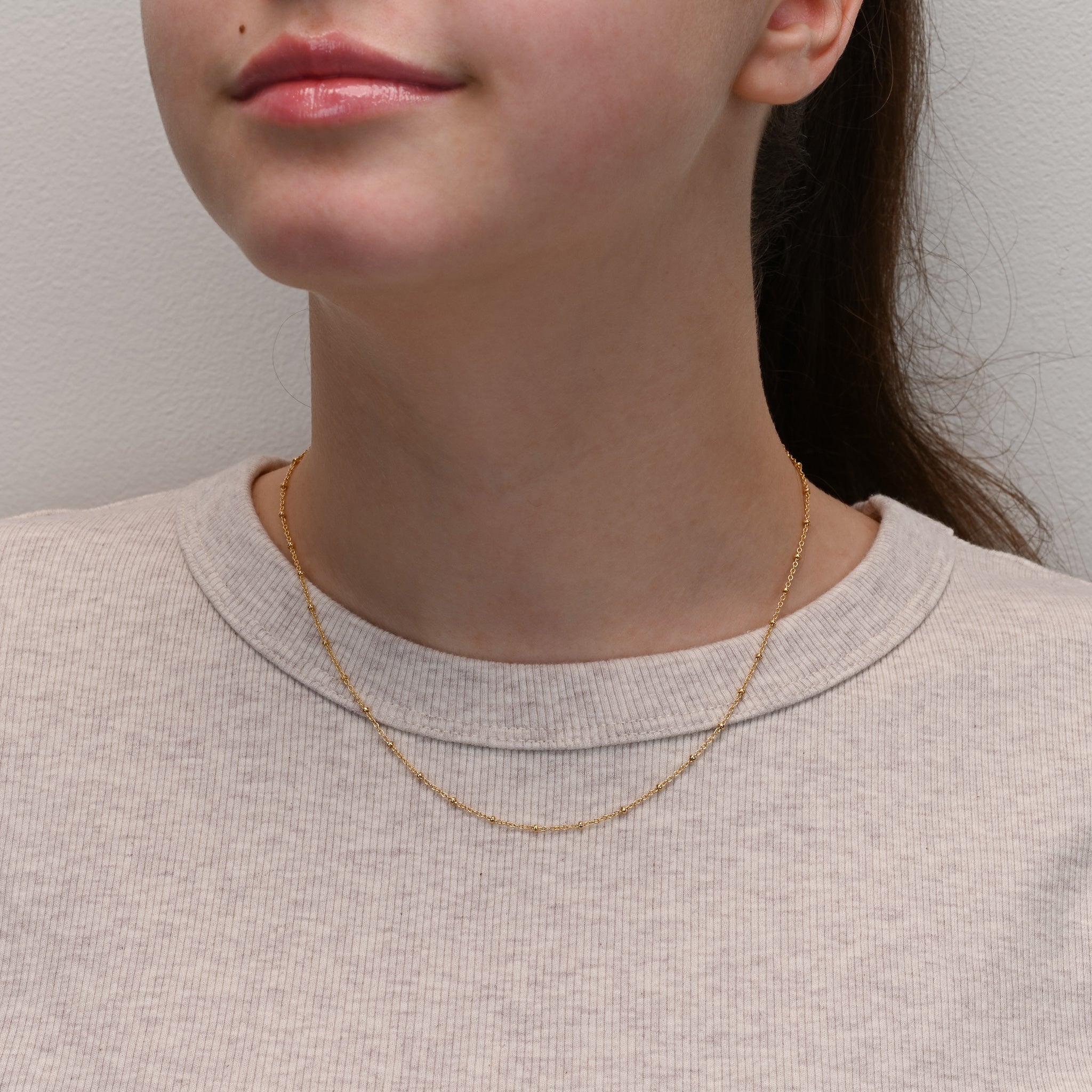 Studio shot of Yellow gold plated silver chain with small beads