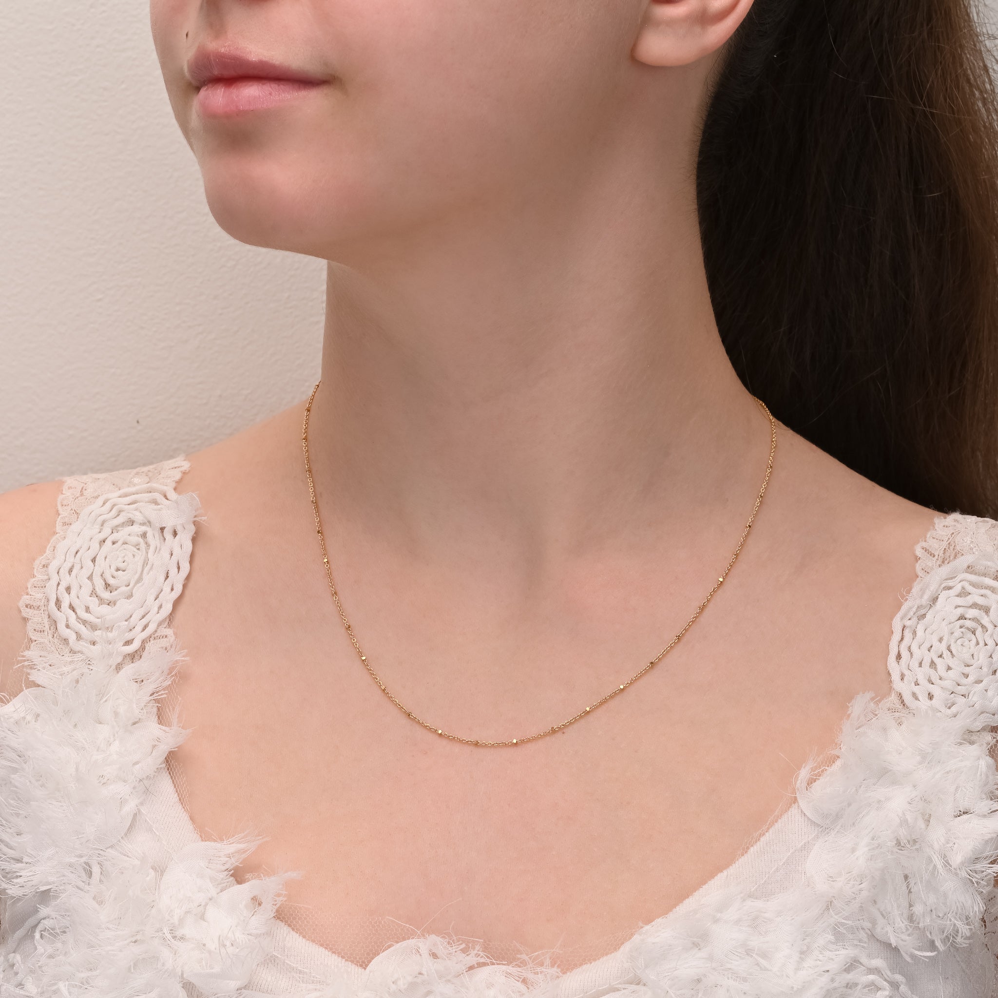 Alternate angle of Gold cable chain with square beads