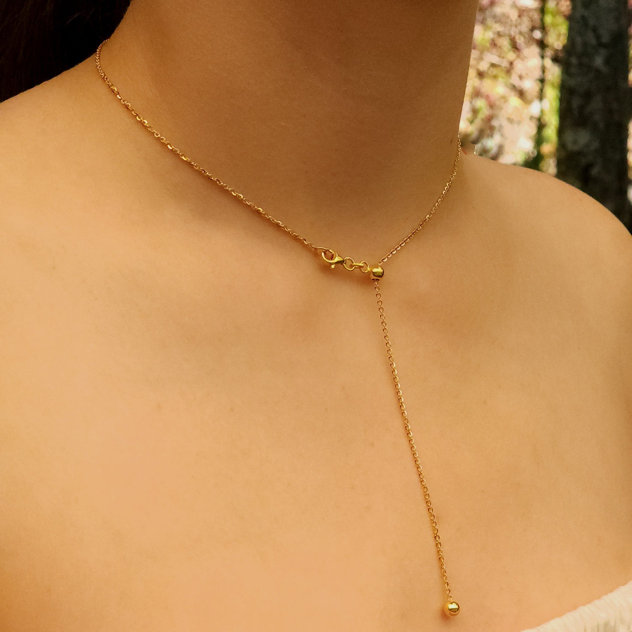 Studio shot of Sliding Bead Silver Chain, Gold Plated