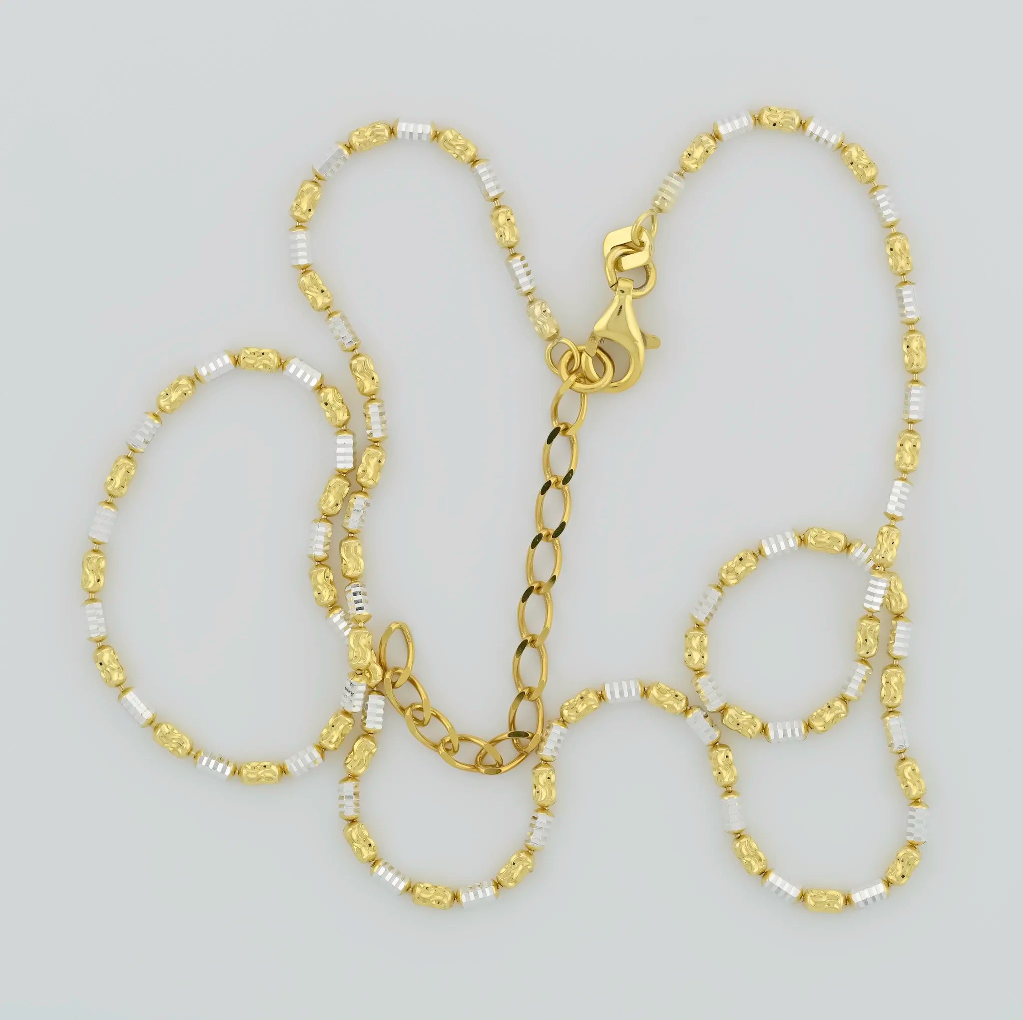 Side view of Yellow Gold & Rodium Beaded Silver Chain