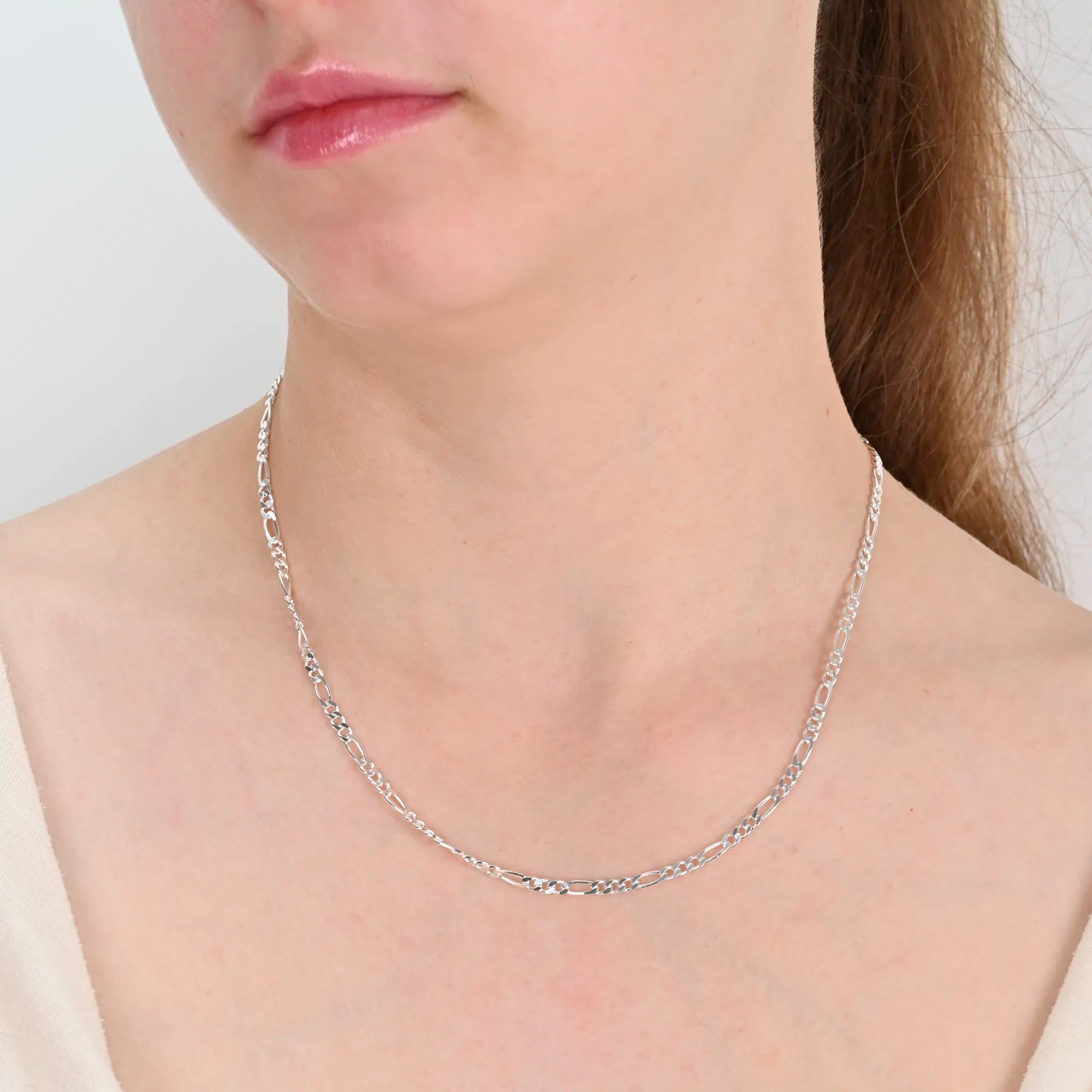 Close-up detail of Figaro silver chain 3mm